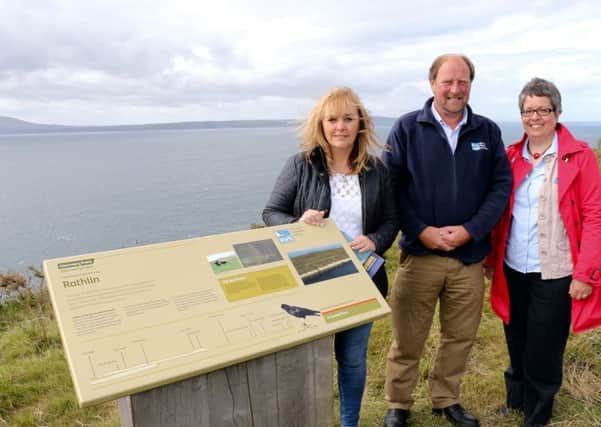 DAERA Minister McIlveen visits Rathlin Island to hear how RSPBNI, the Rathlin Development Community Association and NIEA are working together to protect wildlife on the Island. Pictured from left-right are Minister McIlveen, Liam McFaul, RSPBNI local warden on Rathlin and Joanne Sherwood, Director RSPBNI.