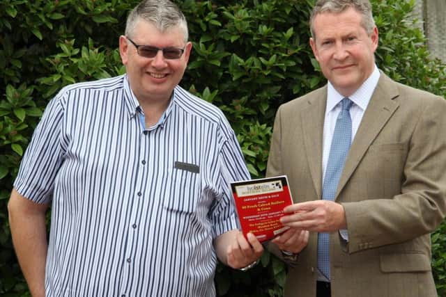 Holstein NI secretary John Martin discusses dates for the forthcoming monthly dairy sales at Dungannon with auctioneer Michael Taaffe.