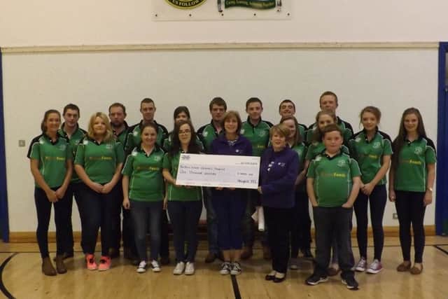 Club members presenting the cheque to representatives from the Northern Ireland's Children's Hospice