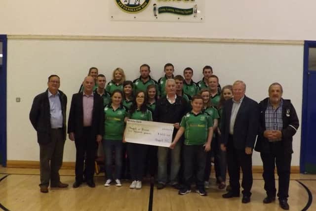 Club members presenting the cheque to representatives from Ahoghill in Bloom
