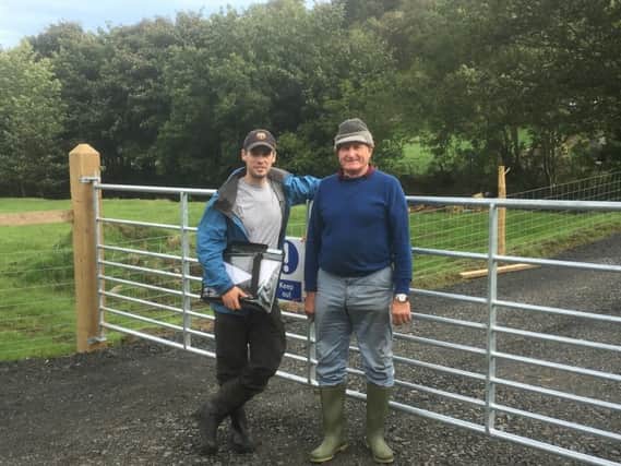 John McAuley ( right) with Brian Gaynor from The Causeway Coast and Glens Heritage Trust at the entrance gate the soon to be opened Ronans Way which is named in memory of Johns son.