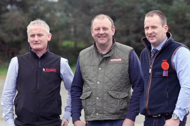 NI Simmental Club chairman Matthew Cunning, centre, is pictured at the autumn show and sale with sponsor Kevin McAnenly, Bimeda; and judge Jonny Hazelton, Dungannon. Picture: Julie Hazelton