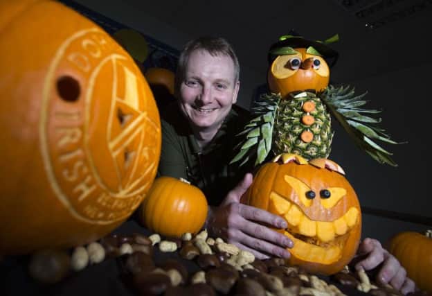 David Caldwell with a caved pumpkin
