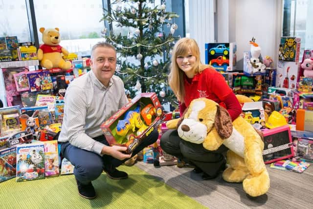 Trevor Lockhart, Fane Valley, Chief Executive, pictured with Rosie Arthur, Service Coordinator, Action for Children.