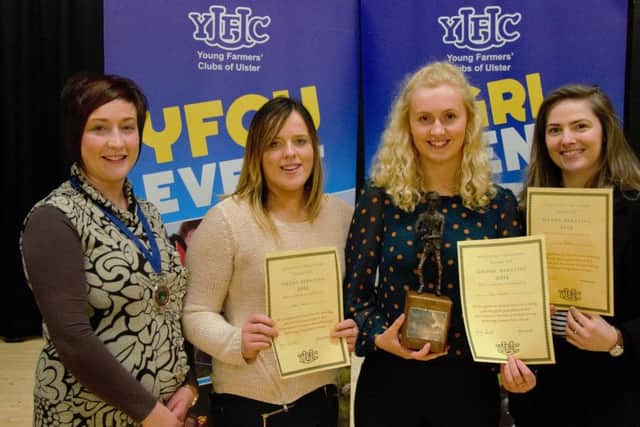 Pictured is the winning 21-25 category group debating team, Heather Martin, Joy Dalzell and Jane Patton receiving the Ciba Geigy Perpetual trophy Roberta Simmons, YFCU President.