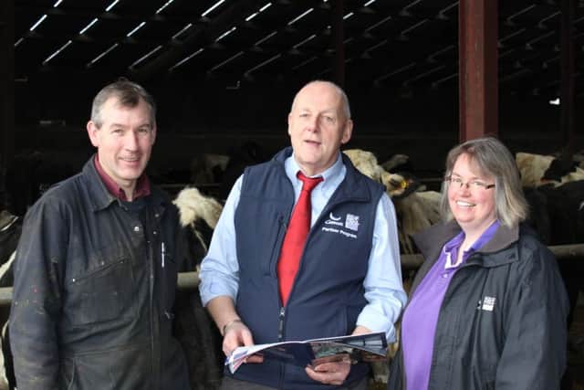 Mark and Pamela Robinson, Dungiven discussing sire selection for the coming year with local breeding adviser, John Sayers, Genus ABS.