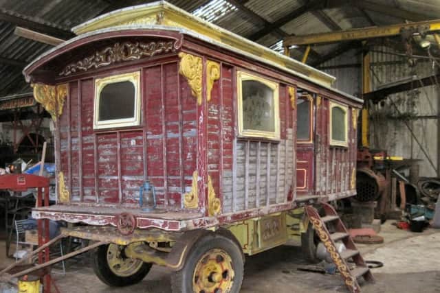 The Brayshaw-style living wagon which has ornate carving and showmans script. It has been kept in dry storage for 30-years and is in need of restoration, however it has a coal-fired cooking range and all original fixtures and fittings, it has an estimate of Â£9,000-Â£11,000