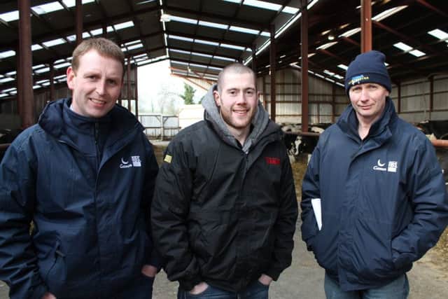 James Woods, left, Genus ABS is pictured at the RMS open day at Norman and James Morton's farm, Armagh with Chris Coote, Dungannon and David Presho, Comber
