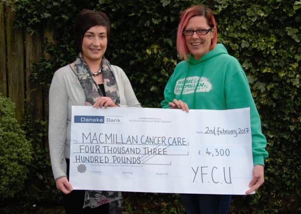 Young Farmers Clubs of Ulster president Roberta Simmons is pictured presenting a cheque for Â£4,300 to Macmillan Cancer Supports fundraising manager Joanne Young after the YFCUs Got Talent presidents event
