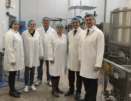 Margaret Ritchie MP and SDLP Assembly candidate Colin McGrath pictured with staff from Down Sauce Company in Downpatrick