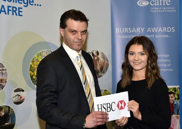 Student Anna Millar is presented with her Â£1,500 bursary by Nigel Young, HSBC agricultural relationship director