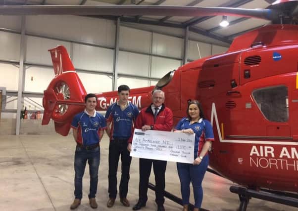 Members of Collone YFC making a cheque presentation to Northern Ireland Air Ambulance