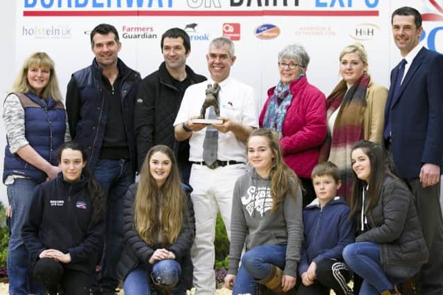 Mark Nutsford of the Riverdane Herd, Cheshire, is presented with the John Dennison Award by the Dennison family