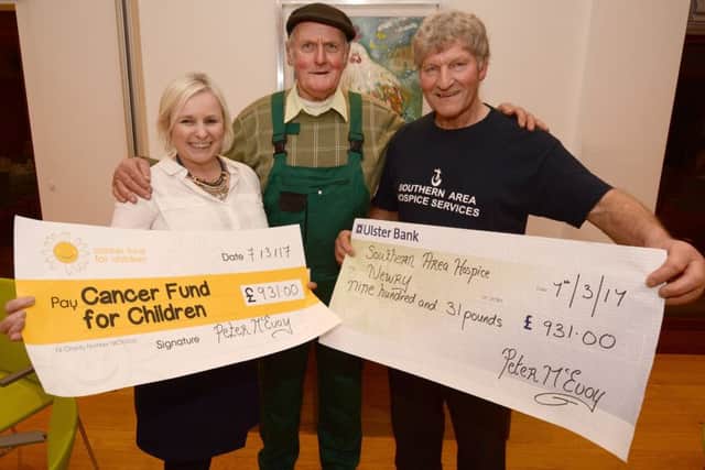 Mr Peter McEvoy, organiser of the Boxing Day Tractor Run at Katesbridge, makes cheque presentations of Â£931.00 to Cancer Fund For Children representative Joan Burden, Hospitality Manager Daisy Lodge, Bryansford and local Southern Area Hospice representative John Jardine.  Â© Photo: Gary Gardiner.  WK11-005GG.