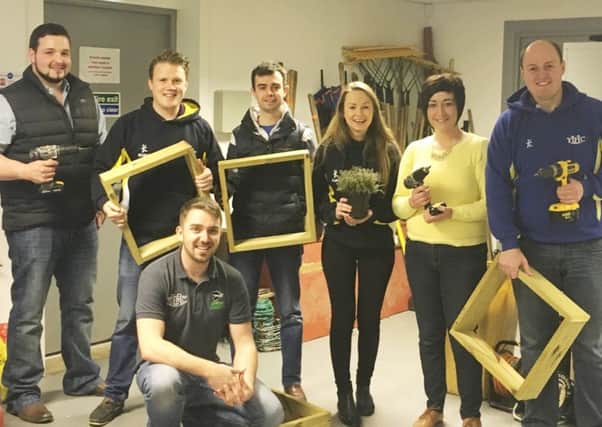 YFCU members put the finishing touches to the herb garden that will now feature prominently at the front entrance to the UFU/YFCU headquarters' building in Belfast. The initiative has been undertaken as part of the YFCU's commitment to the Grassroots' Challenge'