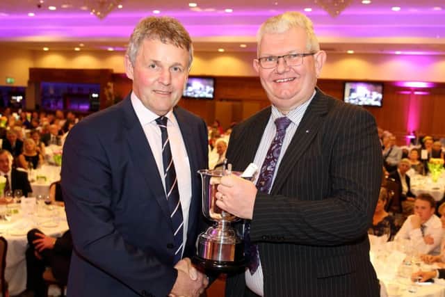 This year the Cuthbert Trophy was awarded to the West Antrim Group for retaining the highest percentage of their members in 2016. Pictured receiving the trophy is Ivan Johnston with Barclay Bell, UFU president