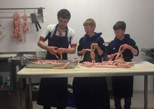 Randalstown YFC members Aaron and Daniel taking part in the butcher's talk from Jonny McMaster
