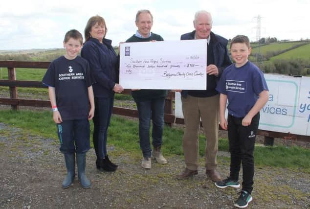 Myles Heslip and Sam McElroy representing the event organisers with Bob Wilson and Alexander Mills Joint Masters of Iveagh Fox hounds present a cheque for Â£2,700 to Tania Bailie, Marketing Manager from south Area Hospice Services. A further Â£350 has since been donated and has been forwarded to the Hospice bringing the total to Â£3050.
