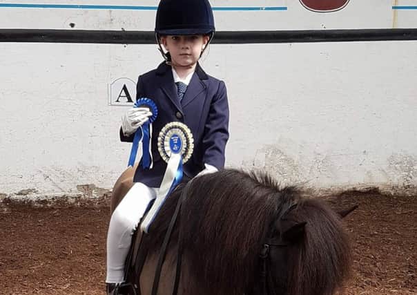 Little Amelia Wheeler on Beltoy Kizzara took second place in the Intro class