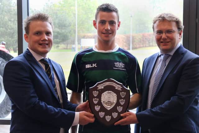 Ulster Young Farmer 25-30 years old winner John Porter from Annaclone and Magherally YFC is presented with the Roberta Simmons Shield by Mark Forsythe from sponsor Danske Bank and YFCU president James Speers