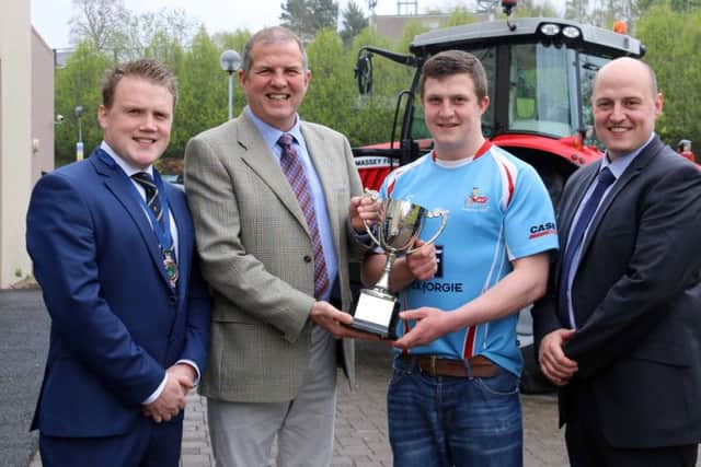 Winners of Club of the Year sponsored by Power NI were Dungiven YFC. Pictured are, left to right, YFCU president James Speers, Alan Egner from Power NI, and James Purcell and David Oliver from Dungiven YFC