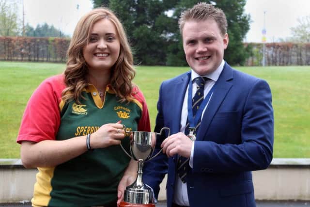 Kerry Rea from Cappagh YFC who was awarded top club secretary is pictured with James Speers, YFCU president