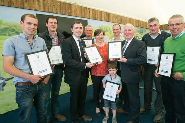 Pictured at the Dale Farm Milk Quality Improvement Awards at Balmoral Show are the full group of Dale Farm dairy farmers, awarded for their milk quality improvement.  Presenting the awards are Stephen Hughes, Ulster Bank and John Dunlop, Chairman, Dale Farm Group.