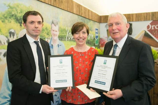 At the Dale Farm Milk Quality Improvement Awards at Balmoral Show, Norman Houston, who has a dairy farm in Strabane, won the Area 4 category and the Overall Award for Best Milk Quality Improvement. Presenting the awards are Stephen Hughes, Ulster Bank and John Dunlop, Chairman, Dale Farm Group. Pictured receiving the award on behalf of her brother Norman is Ruth Houston.