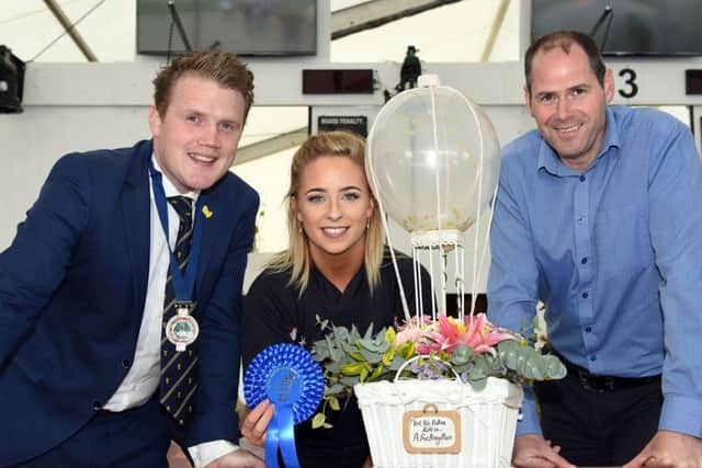 Pictured are the 18-21 age category winners in the YFCU floral art competition. From left-right: YFCU president, James Speers,  second place winner, Rachel Barr, Kells and Connor YFC and Stephen McGill, commercial manager from sponsor, Tesco NI. Not pictured, first place winner, Ellen Woods, Annaclone and Magherally YFC