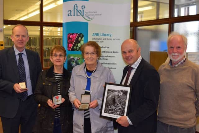 John Clarkes daughter, Miriam Hanna and niece, Rosemary McGarry, bring material for an exhibit to celebrate his achievements in potato breeding in Northern Ireland.