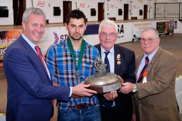 Jack Robinson, second from left, Claudy, was the winner of the Zoetis sponsored Royal Ulster National Sheep Shearing Championship Finals at Balmoral Show. Raymond Irvine of Zoetis is pictured making the presentation along with Edwin Adams, Vice President, RUAS and Robert Harkness, Chief Steward, Sheep Section. Photograph: Columba O'Hare