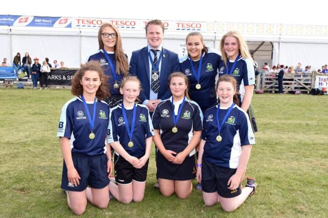 Pictured are team members from Spa YFC who were crowned junior champions at the YFCUs girls football final held at Balmoral Show 2017. Congratulating the girls on their achievement is YFCU president James Speers
