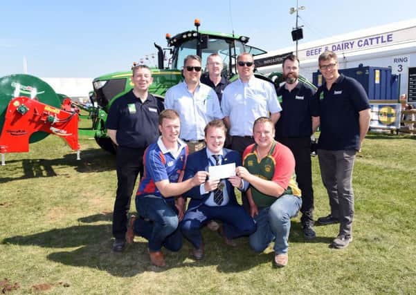 Pictured receiving their first place prize in the YFCU machinery handling competition are county  members  from  YFC and  from  YFC with YFCU president, James Speers, Paul Kelly, HSENI, and Gethin Jones from sponsor Johnston Gilpin and Co. Also pictured are representatives from Johnston Gilpin and Co and HSENI