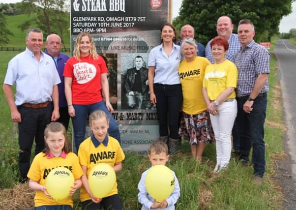 Mr and Mrs Richard Beattie and family with representative's from Aware NI and Chest Heart and Stroke NI, and event organisers for Beanies barbecue and barn dance
