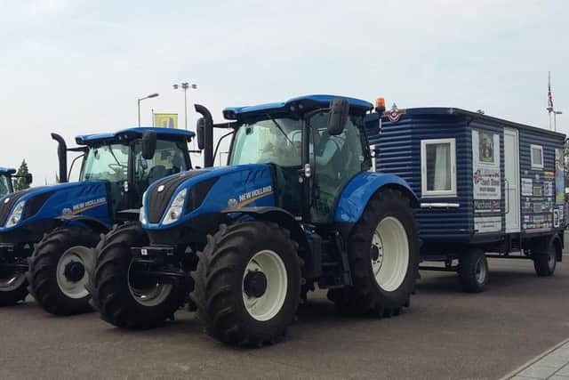 Two members of tractor enthusiast club Blue Force are celebrating after completing a 5,000 mile, 51 day Coastline Tractor Challenge, not previously attempted on tractors