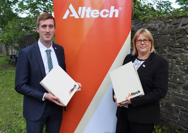 Alltech's Richard Dudgeon and Kate Curran discussing arrangements for next week's Agribusiness Briefing event