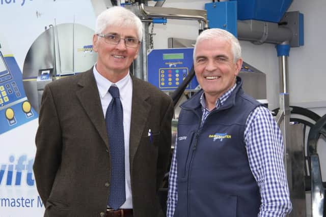 Holstein UK president elect David Perry discusses plans for the two-day Holstein Celebration and AGM with Sean Reid, Cookstown Dairy Services, sponsor. Picture: Julie Hazelton