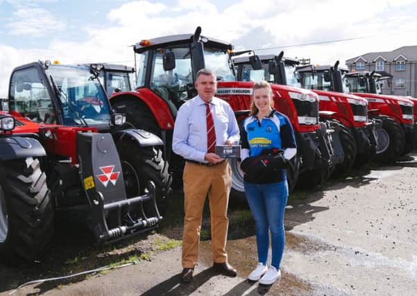 Sean Mc Avoy, Massey Ferguson field support specialist and Ashley McConnell from Holestone YFC who was the winner of the Massey Ferguson caption competition