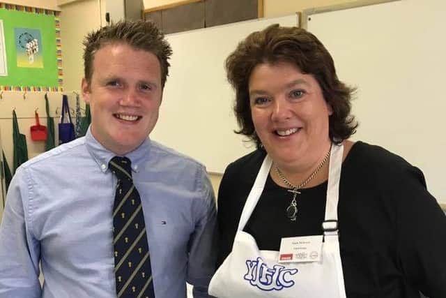 YFCU president James Speers is pictured with judge Paula McIntyre at the YFCU home management finals 2017