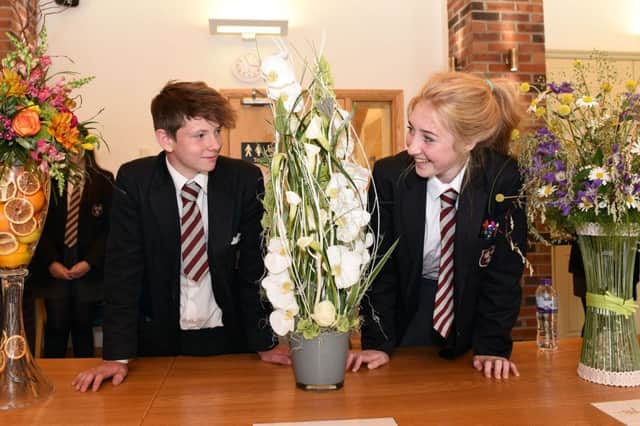 Saintfield High School, Year 10 pupils Ivan and Hollie-Mae admire the stunning floral creations at Greenmount Campus - Grow Careers Schools' Open Day.