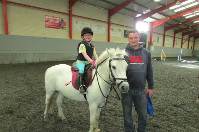 Ceadaoin Currie riding Pepper with her dad - winner of 40cm class