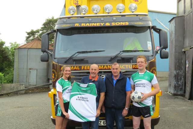 Brian and Alec Rainey presenting the new kits to Ahoghill YFC leader Michael Patterson and club secretary Rachel Gillespie