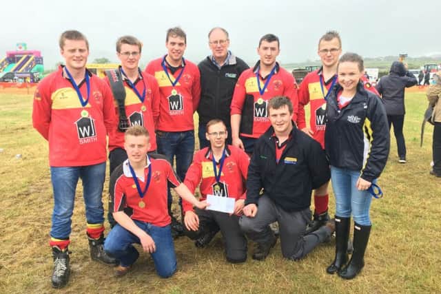 Tug of war winners Derg Valley YFC collect their prize from county chairperson James Purcell, YFCU vice president Zita Blair and Barry Barr