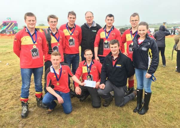 Tug of war winners Derg Valley YFC collect their prize from county chairperson James Purcell, YFCU vice president Zita Blair and Barry Barr