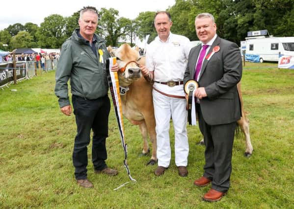 Fergal Keenan of SONI, along with judge Glyn Lucas, present the first place award to Ashley Fleming of Seaforde, Co Down