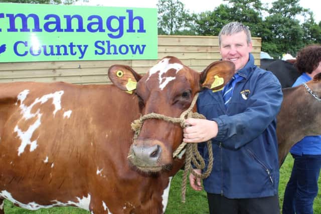 Stewart Baxter, from Shane's Castle, with the Coloured Dairy Breed Champion at Fermanagh Show