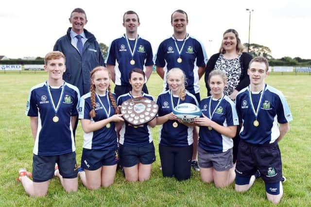 Members of Spa YFC (Team 2) with the Adrian Cooper Shield after winning the senior title at the YFCU 2017 tag rugby tournament at Ballymoney RFC. The winning team are pictured with Robert McCullough, Danske Banks head of agri business, and Carol McMullan, Danske Banks agri-business manager, north
