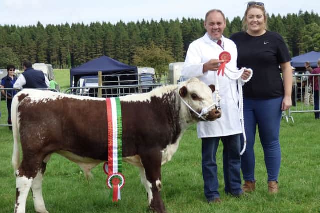 Eddie Giboney was crowed champion in the calf interbreed derby with bull calf, Tyrone Tomboy. Also picture is Eddie's daughter Judy.