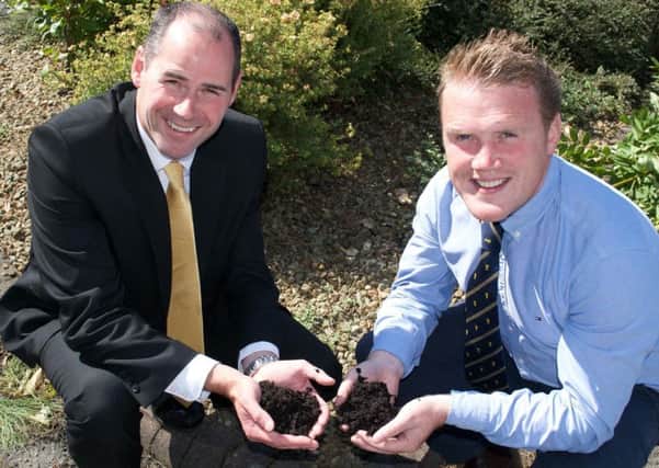 Stephen Magill, Tesco NI commercial manager launching the soil assessment competition with YFCU president, James Speers