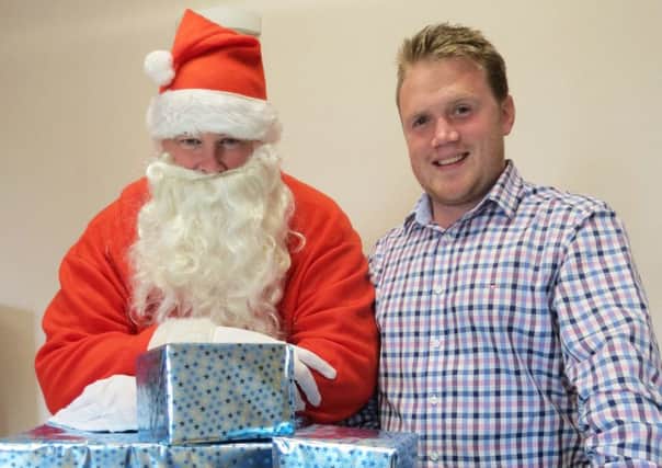 Santa popped into the YFCU headquarters to launch the organisations Christmas Toy Appeal with president James Speers